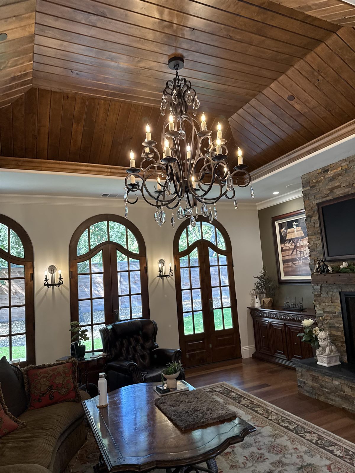 Multi-tier chandelier in a vaulted great room