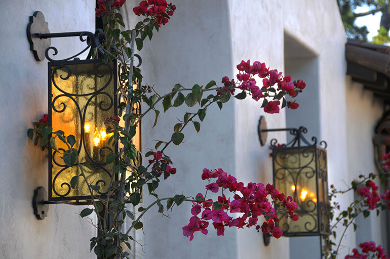 Wrought-iron exterior lanterns with bougainvillea